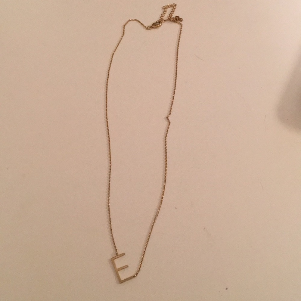 Gold “E” necklace